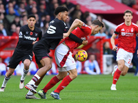 Chris Wood of Nottingham Forest battles with Jean-Clair Todibo of West Ham United during the Premier League match between Nottingham Forest...