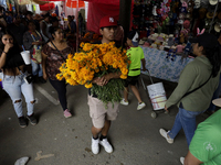 People attend the Tecomitl community cemetery located in the southern end of Mexico City, Mexico, on November 2, 2024, where dozens of peopl...