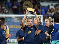 Alexia Putellas presents the trophy for the best women's team in the world to the fans before the match between FC Barcelona Women and SD Ei...