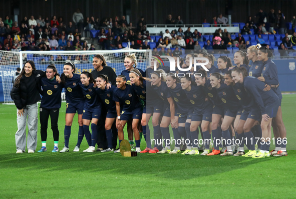 FC Barcelona players present the trophy for the best women's team in the world to the fans before the match between FC Barcelona Women and S...