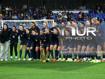 FC Barcelona players present the trophy for the best women's team in the world to the fans before the match between FC Barcelona Women and S...