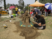 People attend the Tecomitl community pantheon in Mexico City, Mexico, on November 2, 2024, and decorate the graves of their deceased loved o...