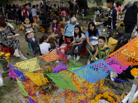 People attend the Tecomitl community pantheon in Mexico City, Mexico, on November 2, 2024, and decorate the graves of their deceased loved o...