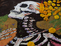 A view of a grave in the Tecomitl community pantheon in Mexico City, Mexico, on November 2, 2024, shows dozens of people decorating the grav...