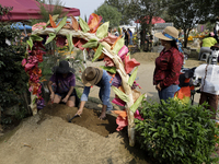 People attend the Tecomitl community pantheon in Mexico City, Mexico, on November 2, 2024, and decorate the graves of their deceased loved o...