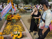 A view of a trans flag at the Tecomitl community cemetery in Mexico City, Mexico, on November 2, 2024, shows dozens of people decorating the...