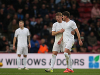 Tommy Conway consoles Hayden Hackney following his red card during the Sky Bet Championship match between Middlesbrough and Coventry City at...