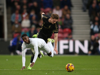 Isaiah Jones of Middlesbrough is fouled by Jack Rudoni of Coventry City during the Sky Bet Championship match between Middlesbrough and Cove...