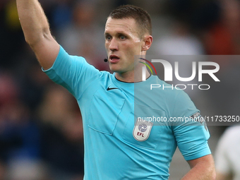 Referee Thomas Brammell brandishes a yellow card during the Sky Bet Championship match between Middlesbrough and Coventry City at the Rivers...