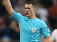 Referee Thomas Brammell brandishes a yellow card during the Sky Bet Championship match between Middlesbrough and Coventry City at the Rivers...