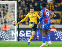 Santiago Bueno of Wolves, number 4, gets his toe to the ball during the Premier League match between Wolverhampton Wanderers and Crystal Pal...