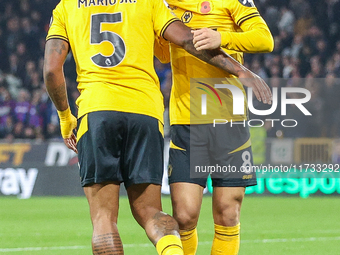 #5, Mario Lemina of Wolves congratulates #8, Joao Gomes for his goal during the Premier League match between Wolverhampton Wanderers and Cry...