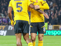 #5, Mario Lemina of Wolves congratulates #8, Joao Gomes for his goal during the Premier League match between Wolverhampton Wanderers and Cry...