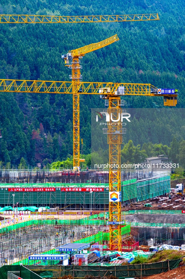 Workers work at the construction site of the Sichuan Can Invest Bazhong (Tongjiang) gas-fired power generation project in Jintang Industrial...