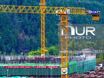 Workers work at the construction site of the Sichuan Can Invest Bazhong (Tongjiang) gas-fired power generation project in Jintang Industrial...