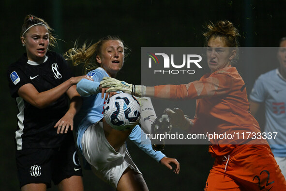 Mina Bergersen of F.C. Como Women, Federica D'Auria of S.S. Lazio, and Astrid Gilardi of F.C. Como Women are in action during the 8th day of...