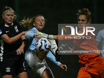 Mina Bergersen of F.C. Como Women, Federica D'Auria of S.S. Lazio, and Astrid Gilardi of F.C. Como Women are in action during the 8th day of...