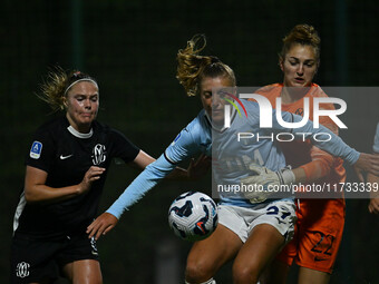 Mina Bergersen of F.C. Como Women, Federica D'Auria of S.S. Lazio, and Astrid Gilardi of F.C. Como Women are in action during the 8th day of...