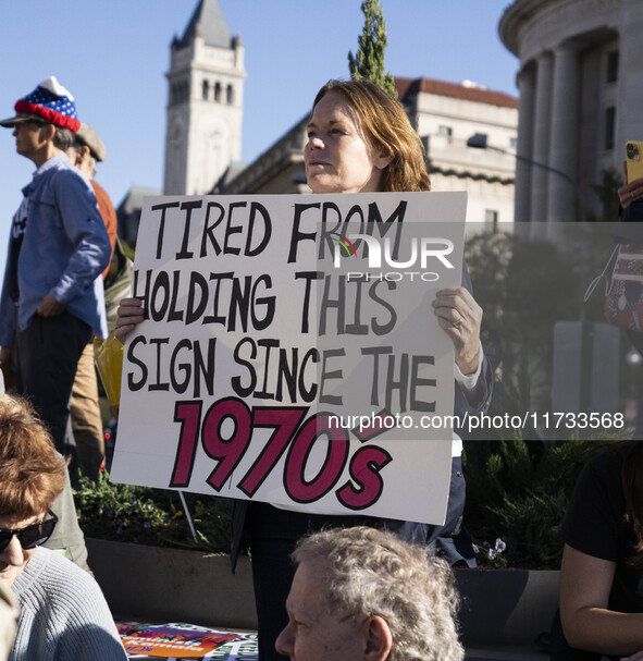 The women's march takes place in Washington, D.C., on November 2, 2024, where thousands of people gather at Freedom Plaza. Eight counter-pro...