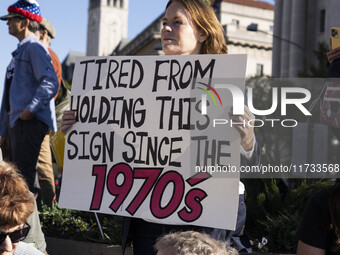 The women's march takes place in Washington, D.C., on November 2, 2024, where thousands of people gather at Freedom Plaza. Eight counter-pro...