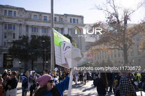 The women's march takes place in Washington, D.C., on November 2, 2024, where thousands of people gather at Freedom Plaza. Eight counter-pro...