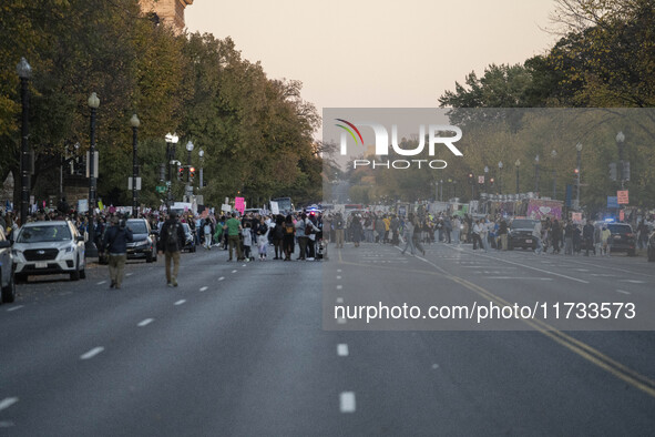 The women's march takes place in Washington, D.C., on November 2, 2024, where thousands of people gather at Freedom Plaza. Eight counter-pro...