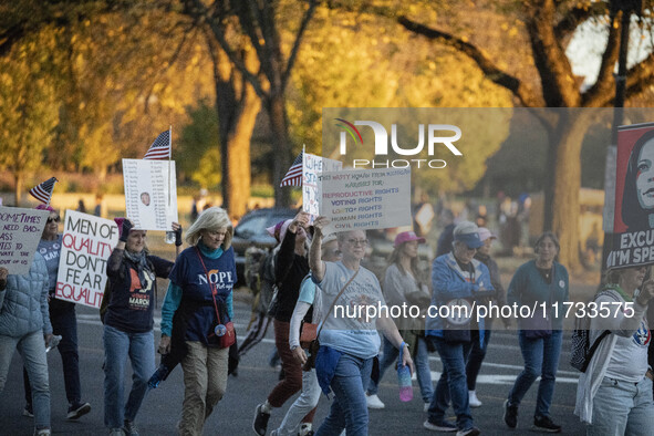 The women's march takes place in Washington, D.C., on November 2, 2024, where thousands of people gather at Freedom Plaza. Eight counter-pro...