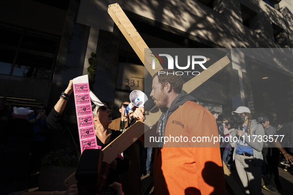 The women's march takes place in Washington, D.C., on November 2, 2024, where thousands of people gather at Freedom Plaza. Eight counter-pro...