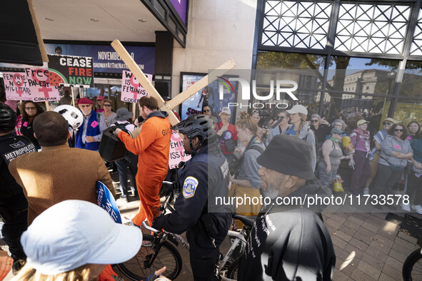 The women's march takes place in Washington, D.C., on November 2, 2024, where thousands of people gather at Freedom Plaza. Eight counter-pro...