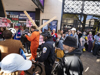 The women's march takes place in Washington, D.C., on November 2, 2024, where thousands of people gather at Freedom Plaza. Eight counter-pro...