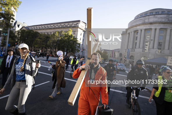 The women's march takes place in Washington, D.C., on November 2, 2024, where thousands of people gather at Freedom Plaza. Eight counter-pro...