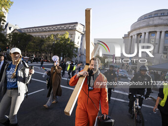 The women's march takes place in Washington, D.C., on November 2, 2024, where thousands of people gather at Freedom Plaza. Eight counter-pro...