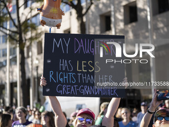 The women's march takes place in Washington, D.C., on November 2, 2024, where thousands of people gather at Freedom Plaza. Eight counter-pro...