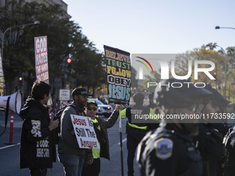 The women's march takes place in Washington, D.C., on November 2, 2024, where thousands of people gather at Freedom Plaza. Eight counter-pro...