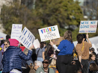 The women's march takes place in Washington, D.C., on November 2, 2024, where thousands of people gather at Freedom Plaza. Eight counter-pro...