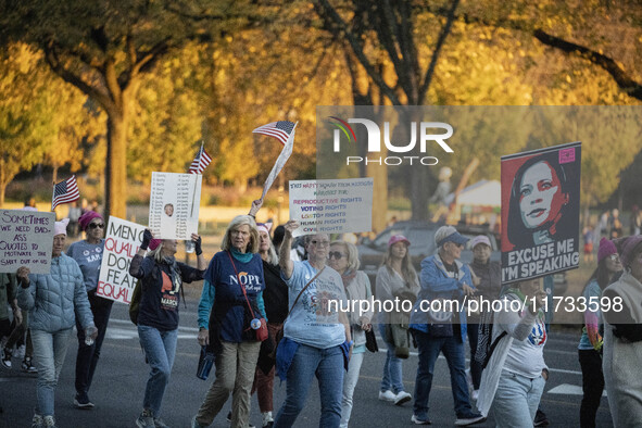 The women's march takes place in Washington, D.C., on November 2, 2024, where thousands of people gather at Freedom Plaza. Eight counter-pro...