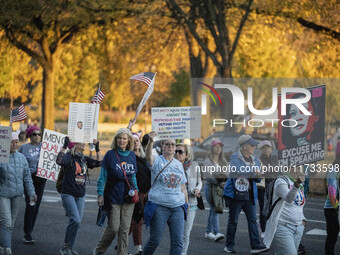 The women's march takes place in Washington, D.C., on November 2, 2024, where thousands of people gather at Freedom Plaza. Eight counter-pro...