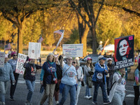 The women's march takes place in Washington, D.C., on November 2, 2024, where thousands of people gather at Freedom Plaza. Eight counter-pro...