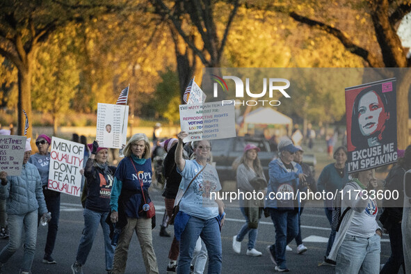 The women's march takes place in Washington, D.C., on November 2, 2024, where thousands of people gather at Freedom Plaza. Eight counter-pro...