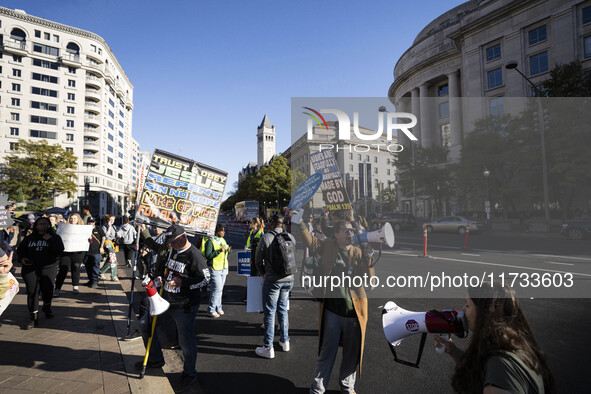 The women's march takes place in Washington, D.C., on November 2, 2024, where thousands of people gather at Freedom Plaza. Eight counter-pro...