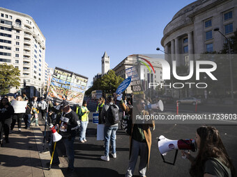 The women's march takes place in Washington, D.C., on November 2, 2024, where thousands of people gather at Freedom Plaza. Eight counter-pro...