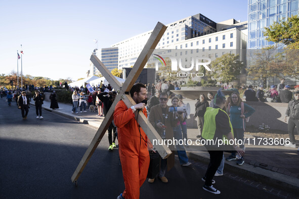 The women's march takes place in Washington, D.C., on November 2, 2024, where thousands of people gather at Freedom Plaza. Eight counter-pro...