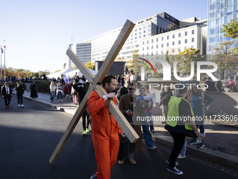 The women's march takes place in Washington, D.C., on November 2, 2024, where thousands of people gather at Freedom Plaza. Eight counter-pro...