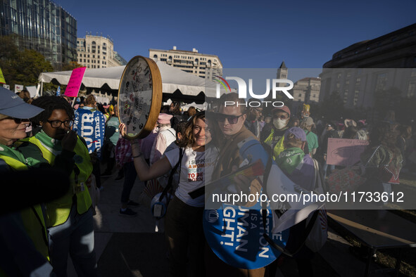 The women's march takes place in Washington, D.C., on November 2, 2024, where thousands of people gather at Freedom Plaza. Eight counter-pro...