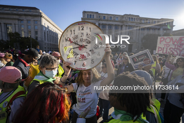 The women's march takes place in Washington, D.C., on November 2, 2024, where thousands of people gather at Freedom Plaza. Eight counter-pro...