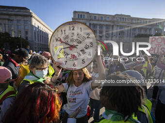 The women's march takes place in Washington, D.C., on November 2, 2024, where thousands of people gather at Freedom Plaza. Eight counter-pro...