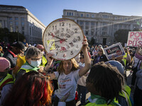 The women's march takes place in Washington, D.C., on November 2, 2024, where thousands of people gather at Freedom Plaza. Eight counter-pro...