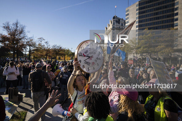 The women's march takes place in Washington, D.C., on November 2, 2024, where thousands of people gather at Freedom Plaza. Eight counter-pro...