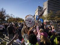 The women's march takes place in Washington, D.C., on November 2, 2024, where thousands of people gather at Freedom Plaza. Eight counter-pro...