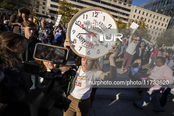 The women's march takes place in Washington, D.C., on November 2, 2024, where thousands of people gather at Freedom Plaza. Eight counter-pro...